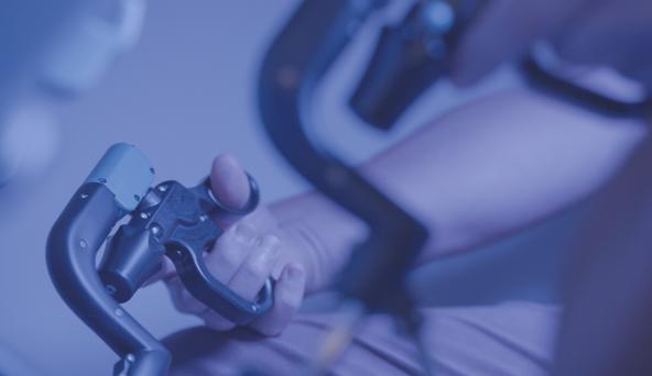A hand holding a controller