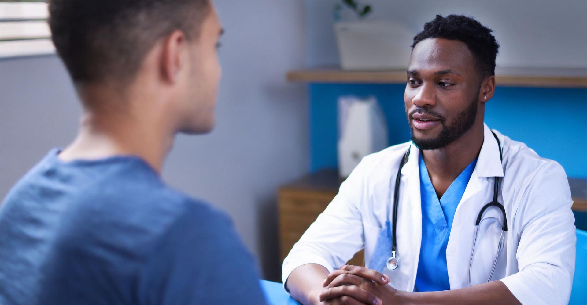 Patient and doctor sitting together at a table 