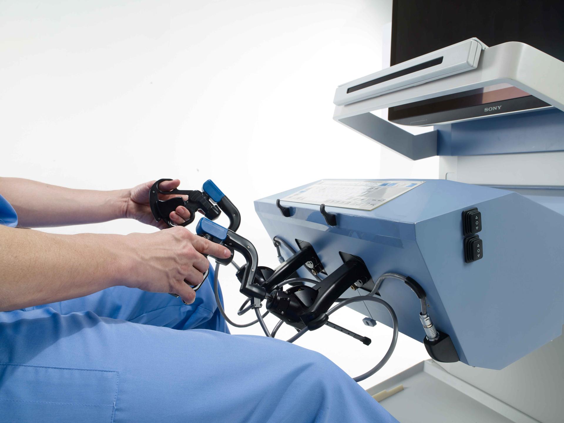 A pair of hands using a controller